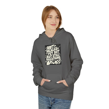 Inspirational Quote Hoodie — "Not Healed Yet But Still Breathing" Graphic Sweatshirt Printify