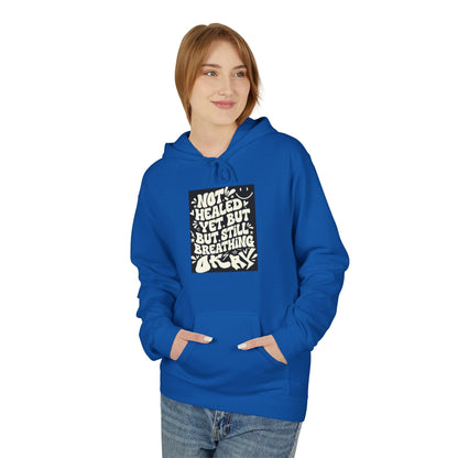 Inspirational Quote Hoodie — "Not Healed Yet But Still Breathing" Graphic Sweatshirt Printify